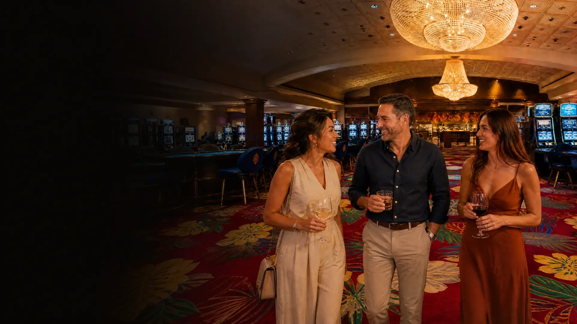 Guests walk through the Silver Slipper casino floor past rows of modern slot machines beneath a crystal chandelier