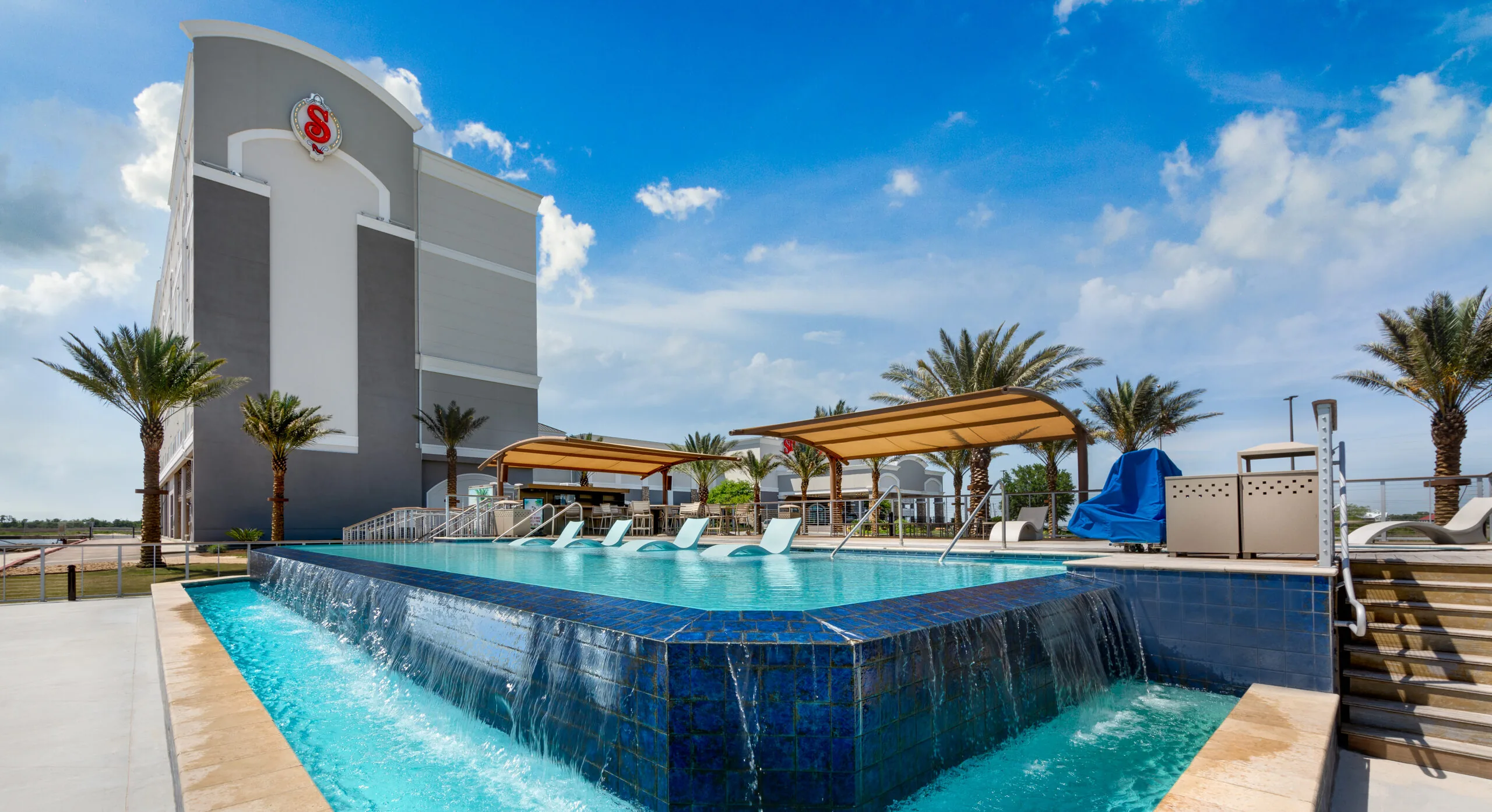 Infinity pool and palm-lined terrace at Silver Slipper Casino & Hotel